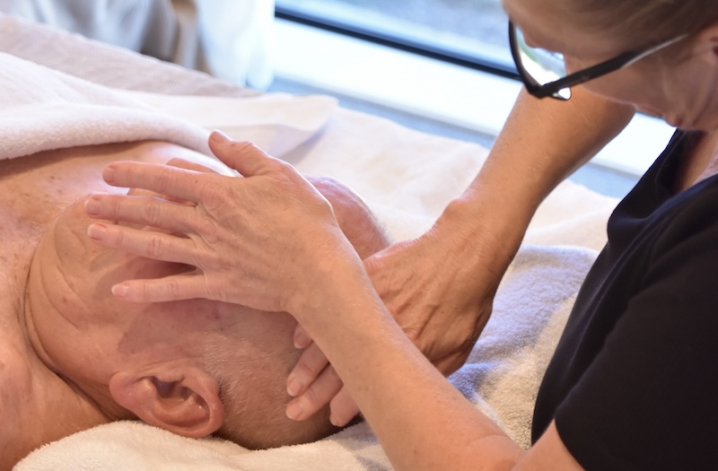 Lynda giving a facial massage