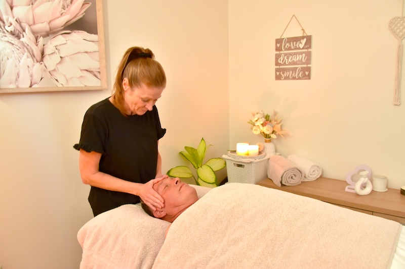 Lynda giving a treatment in her treatment room